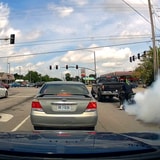 Inconsiderate Biker Gets A Flat Right After Doing A Burn Out At The Stop Light