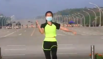 Aerobics Instructor Dances In Front of Myanmar's Parliament Without Realizing The Military Coup Unfolding In The Background
