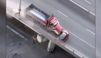 Here's The Terrifying Moment A Woman In A Mini Cooper Was Dragged By A Dump Truck