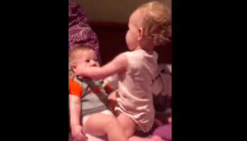 Toddler Has Most Uniquely Persuasive Way Of Feeding Baby Brother